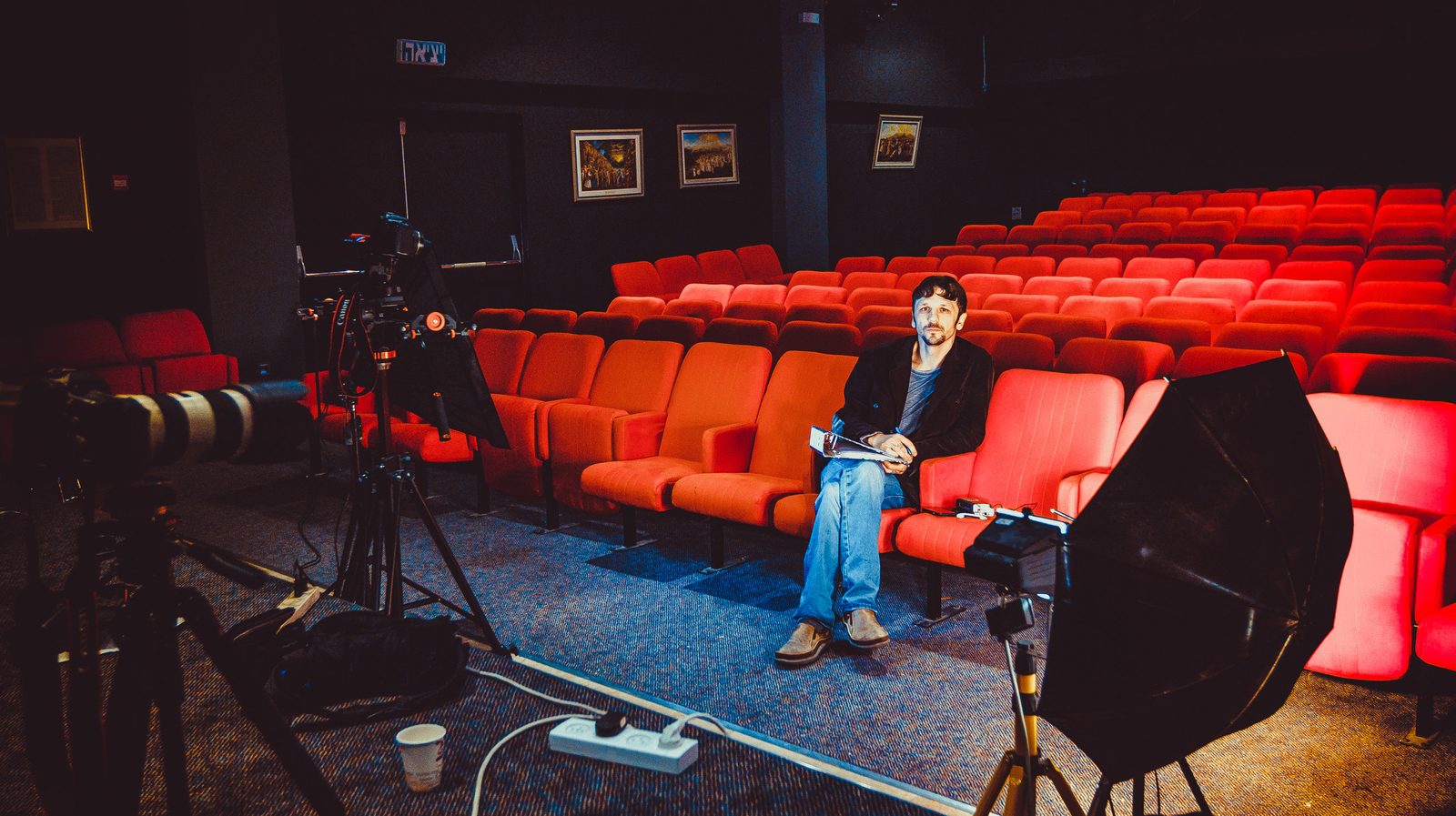 Filming a documentary — interview in a screening room