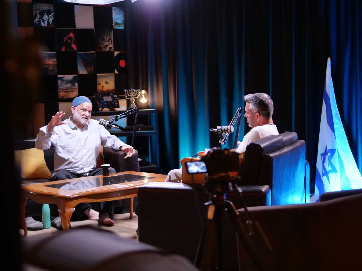 Interview at the GalilTV studio, guest wearing a kippah